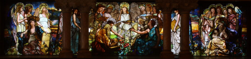 "Education" (1890), a stained glass window by Louis Comfort Tiffany and Tiffany Glass Co.(late 1885-1892), located in Linsly-Chittenden Hall at Yale University. In the center, it depicts Science (personified by Devotion, Labor, Truth, Research and Intuition) and Religion (personified by Purity, Faith, Hope, Reverence and Inspiration) in harmony, presided over by the central personification of "Light·Love·Life". On the left is Art, attended by Form, Color and Imagination. On the right Music, with Rhythm, Melody, Harmony, Verse, and Voice. Perception and Analysis (hidden behind the left pillars) link Art and Science, while a solitary angel, Law, bridges Religion and Music (hidden behind the right pillars).