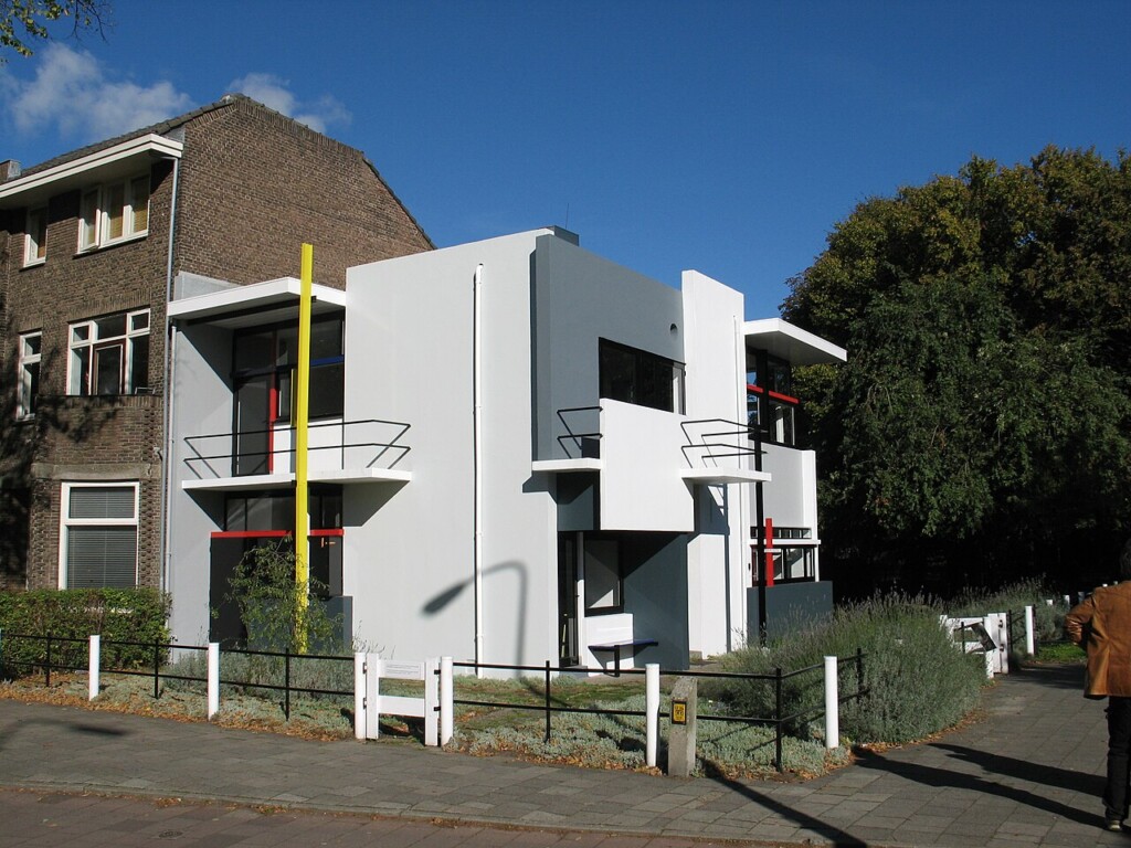 The Rietveld Schröder House (1924) scaled the two-dimensional grids of De Stijl into fully realized environmental architecture.